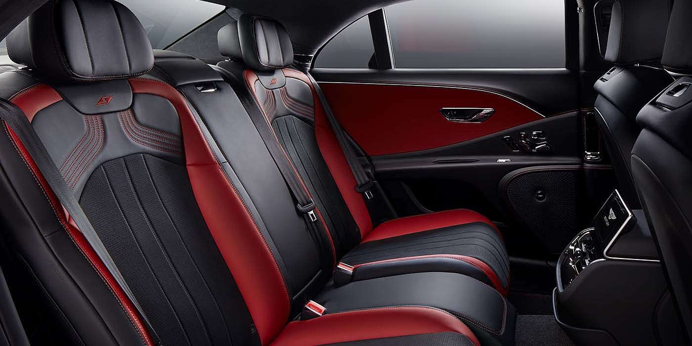 Bentley Marbella Bentley Flying Spur S sedan rear interior in Beluga black and Hotspur red hide with S stitching