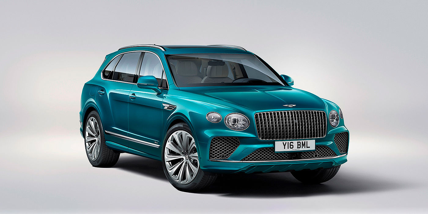 Bentley Marbella Bentley Bentayga Azure front three-quarter view, featuring a fluted chrome grille with a matrix lower grille and chrome accents in Topaz blue paint.