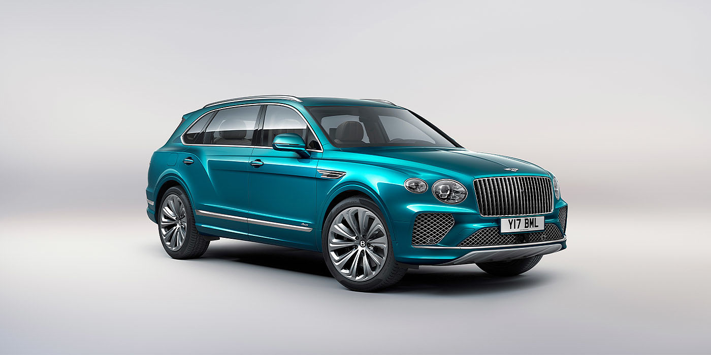 Bentley Marbella Bentley Bentayga EWB Azure front three-quarter view, featuring a fluted chrome grille with a matrix lower grille and chrome accents in Topaz blue paint.