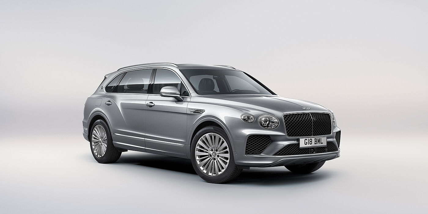 Bentley Marbella Bentley Bentayga Extended Wheelbase luxury SUV front three quarter view in Moonbeam paint with 21 inch five spoke painted wheels