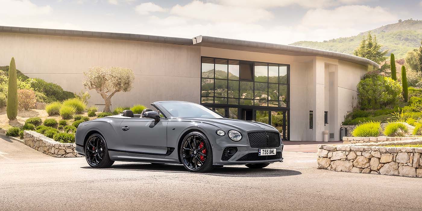 Bentley Marbella Bentley Continental GTC S convertible in Cambrian Grey paint front 34 static near house