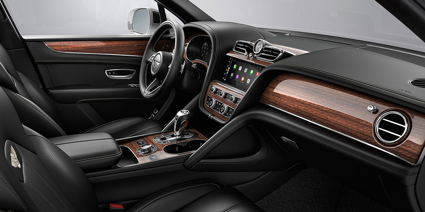 Bentley Marbella Bentley Bentayga interior with a Crown Cut Walnut veneer, view from the passenger seat over looking the driver's seat.