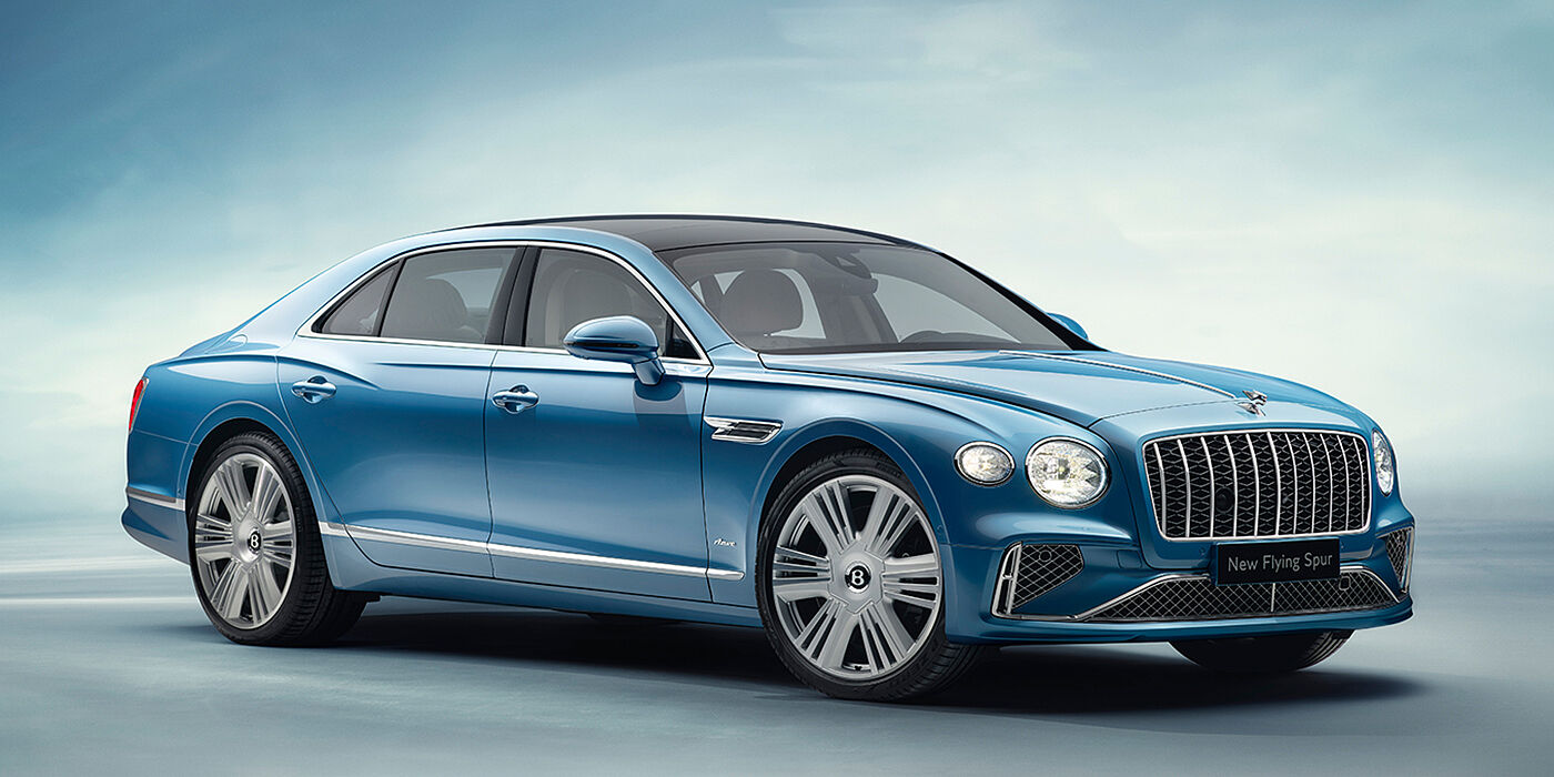 Bentley Marbella New Bentley Flying Spur Azure sedan front view in Light windsor blue by Mulliner paint with 22 inch Azure wheels and chrome exterior details