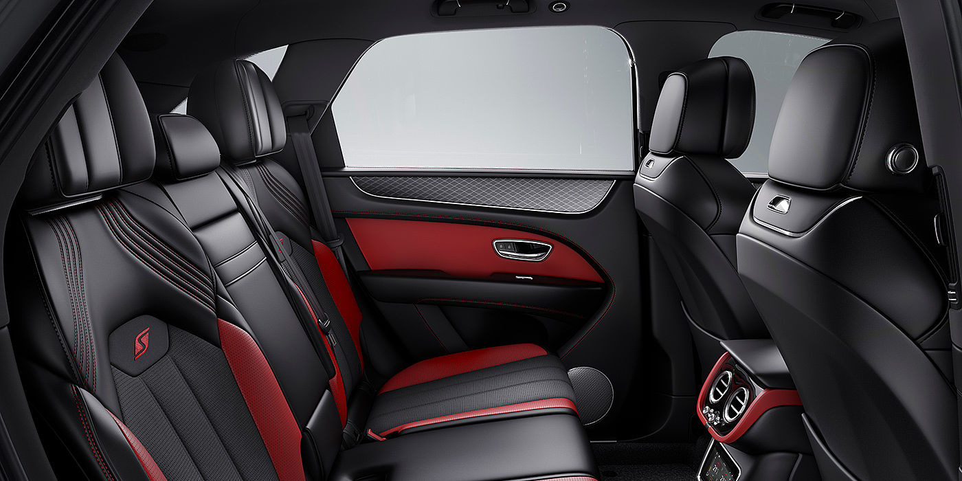 Bentley Marbella Bentey Bentayga S interior view for rear passengers with Beluga black and Hotspur red coloured hide.