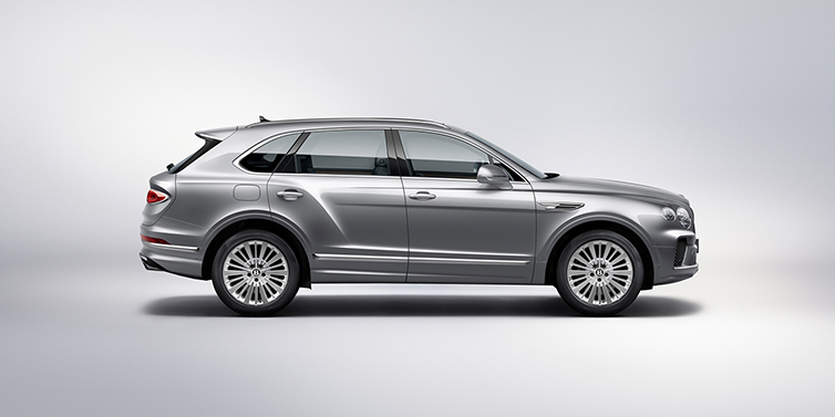 Bentley Marbella Bentley Bentayga SUV side profile in Moonbeam silver paint against white background featuring 21 inch 5 spoke wheels