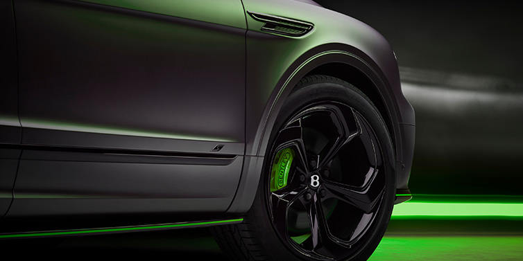 Bentley Marbella Bentley Bentayga S Black Edition SUV exterior wheel detail with Cyber Green brakes with Anthracite Satin paint