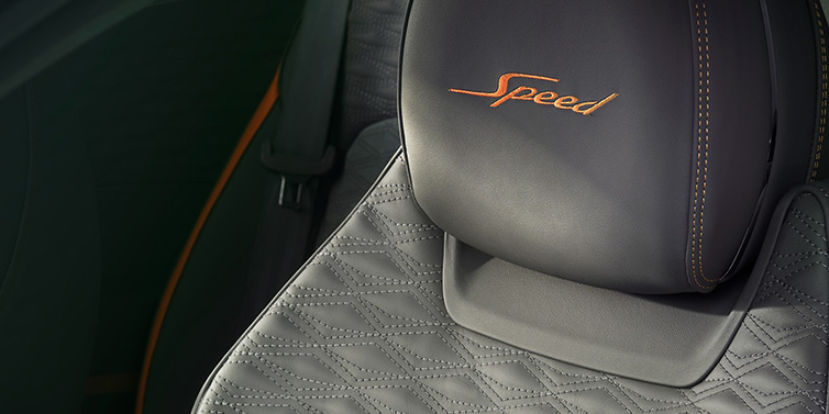 Bentley Marbella Bentley Continental GT Speed coupe seat detail in Gravity Grey hide and Speed emblem in Mandarin by Mulliner coloured embroidery