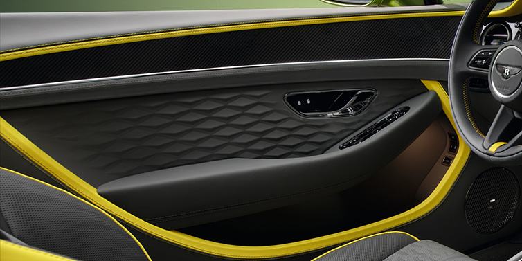 Bentley Marbella Bentley Continental GTC Speed convertible interior door details featuring Gravity Grey and Cyber Yellow by Mulliner hides and high gloss carbon fibre veneer